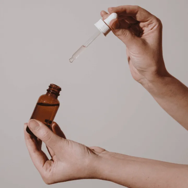 cosmetic serum in hands